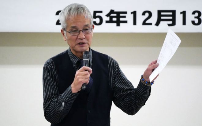 資料を手に、議案の提案を行うKURS事務局長の岡元貞道氏。